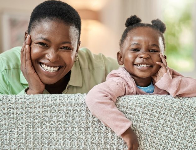 like-mother-like-daughter-cropped-portrait-adorable-little-girl-her-mother-relaxing-sofa-their-living-room-home_590464-62511-transformed